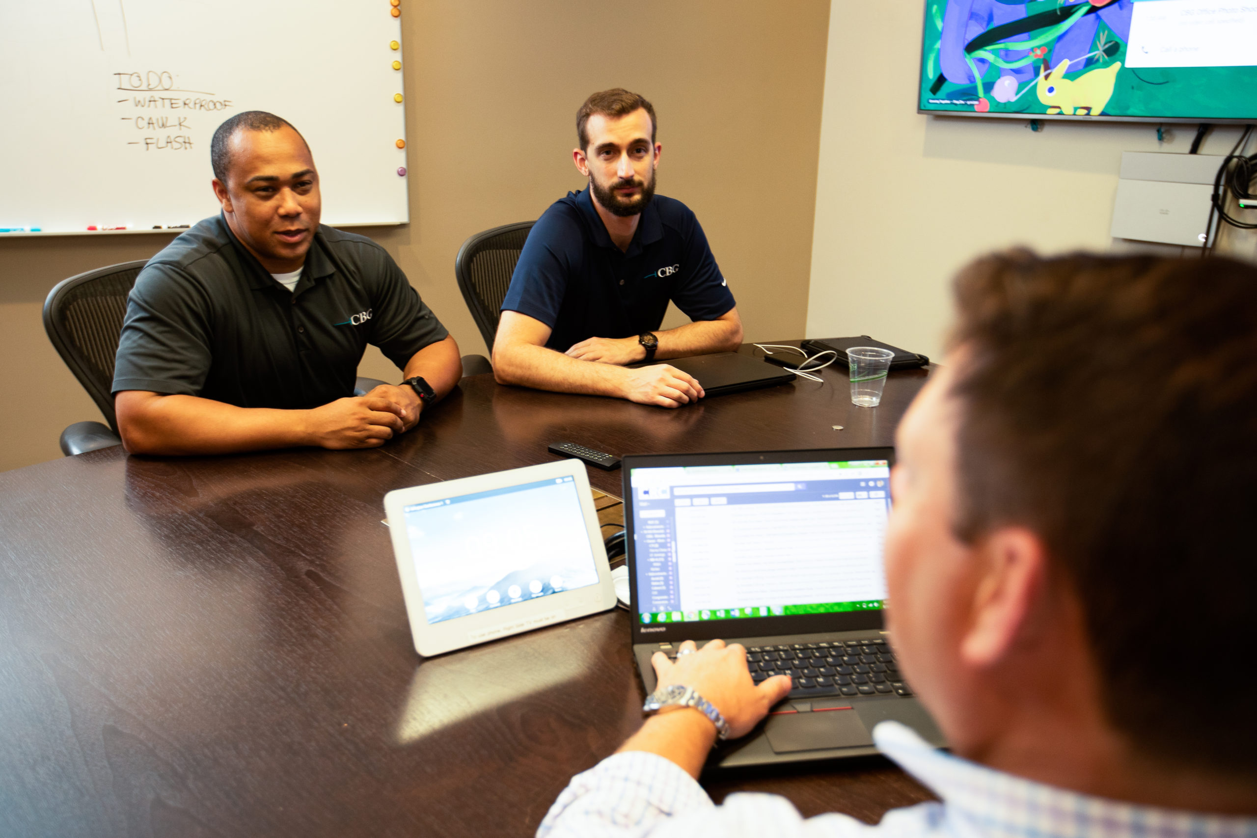 CBG employees at a conference table.